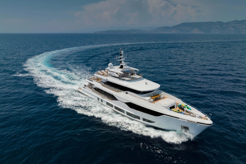 Yacht cruising along the coastline